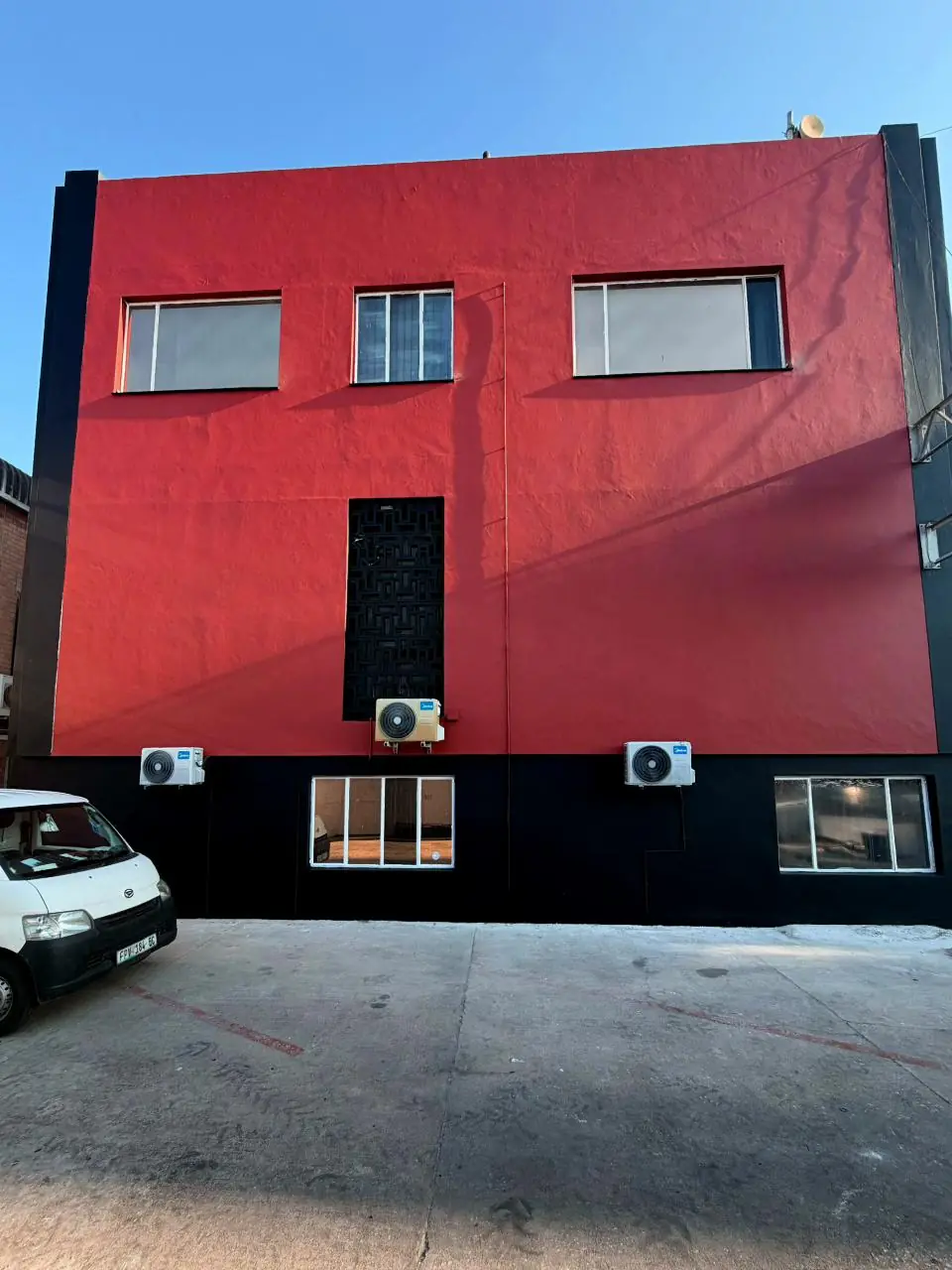 Repainted facade of a commercial building on Kempston Road, Gqeberha, after completion by Under Pressure (1 of 2)